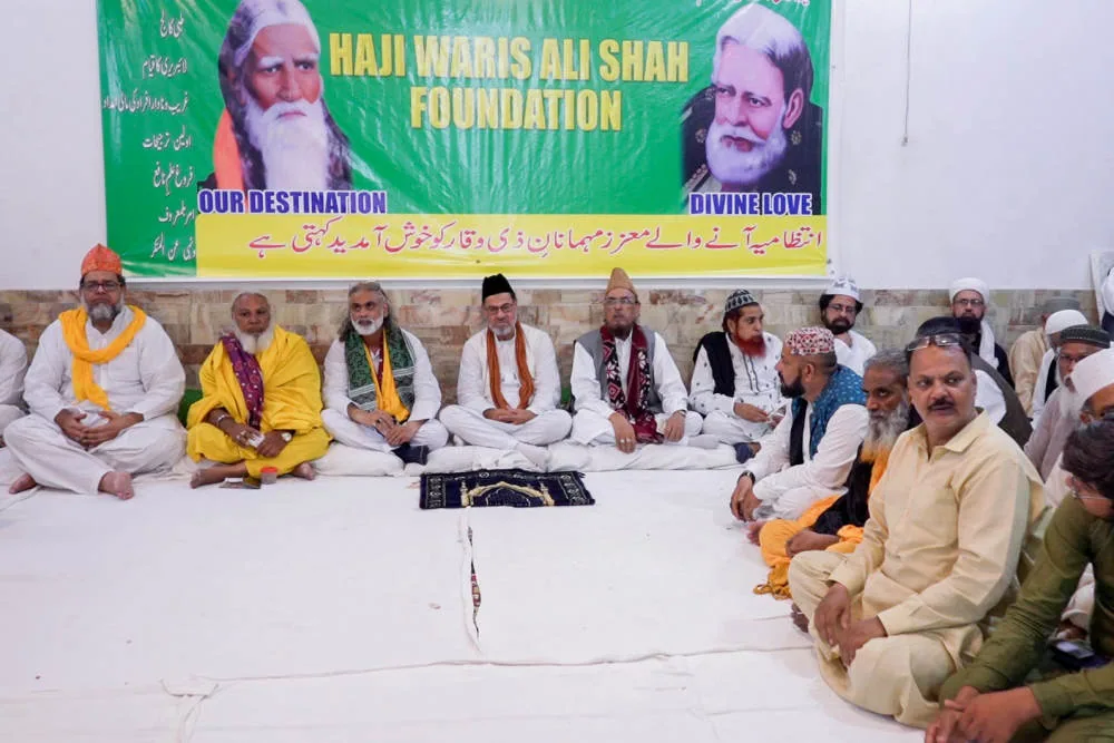 Foundation inauguration gathering beneath the official banner