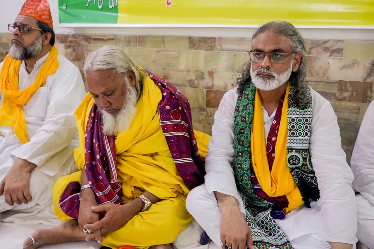 Prominent Sufi figures in traditional attire