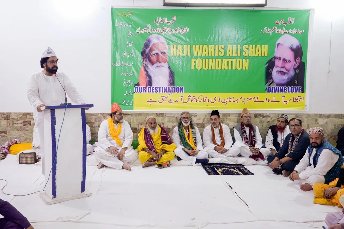 Wide shot of speaker addressing the gathering