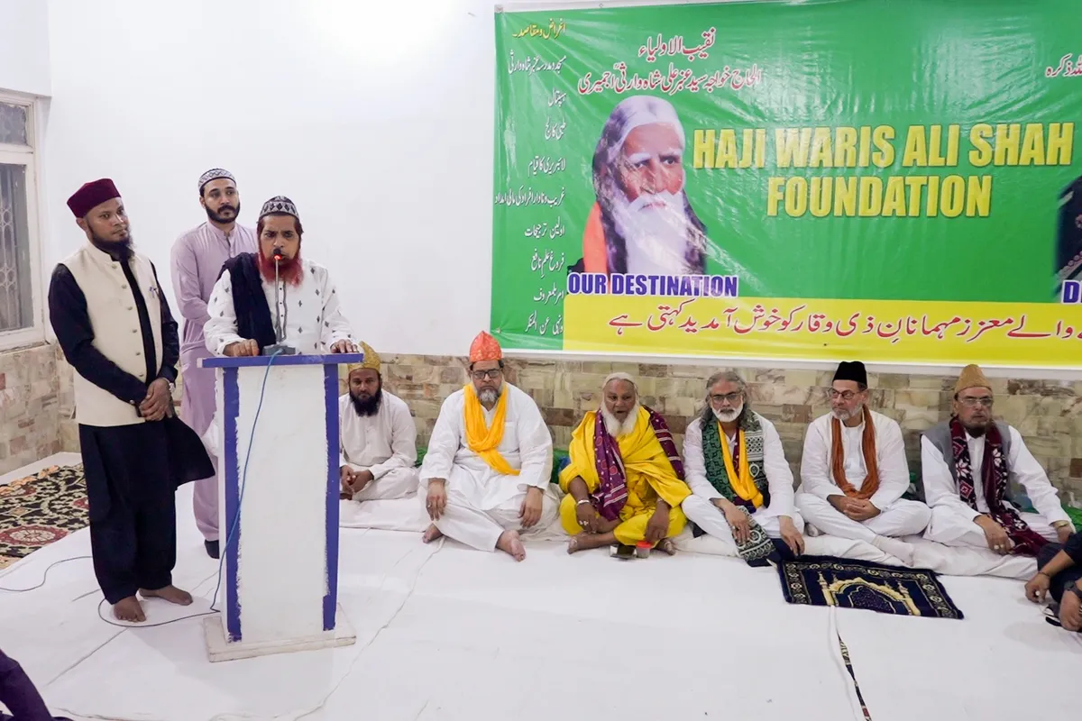 Wide shot of event with seated dignitaries